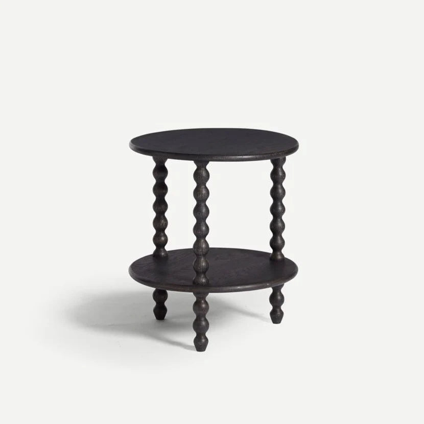 Black wooden side table with spiral legs on a white background,  available  to buy on the-salon.com. SALON curates the finest , unique, handmade pieces from the interior industry's best makers and brands. Shop luxury furniture, lighting, rugs, art, antiques and vintage pieces and accessories from SALON interior designed rooms.