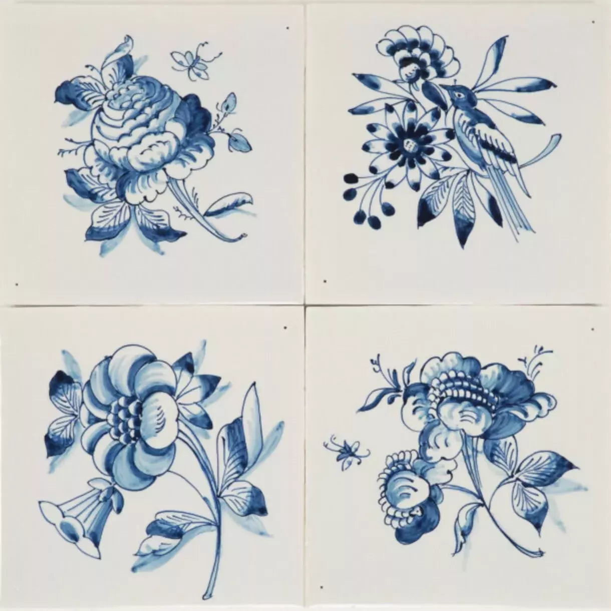 Four blue floral tiles on a white background,  available  to buy on the-salon.com. SALON curates the finest , unique, handmade pieces from the interior industry's best makers and brands. Shop luxury furniture, lighting, rugs, art, antiques and vintage pieces and accessories from SALON interior designed rooms.