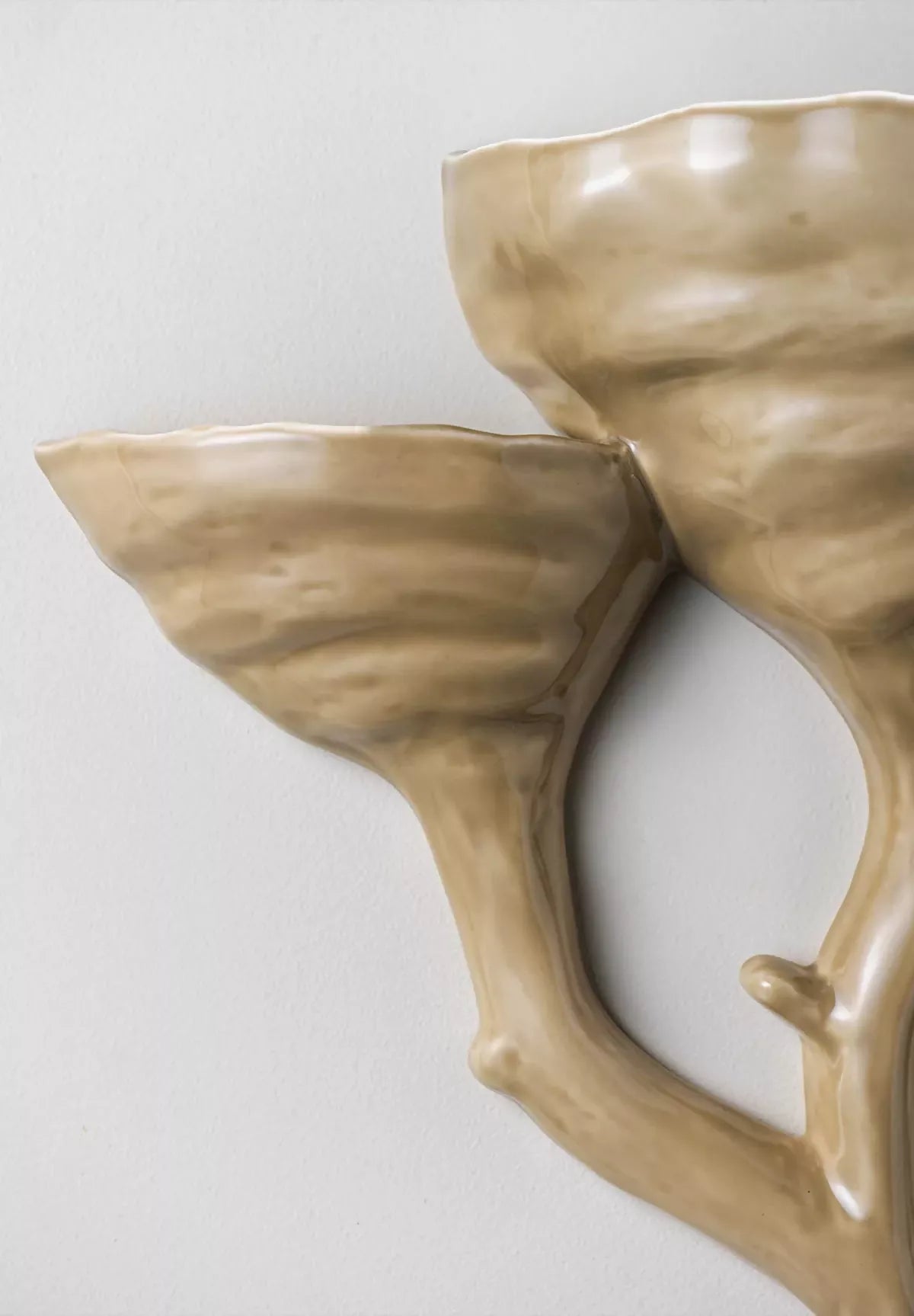 close-up on ceramic almond wall light- available  to buy on the-salon.com. SALON curates the finest , unique, handmade pieces from the interior industry's best makers and brands. Shop luxury furniture, lighting, rugs, art, antiques and vintage pieces and accessories from SALON interior designed rooms.