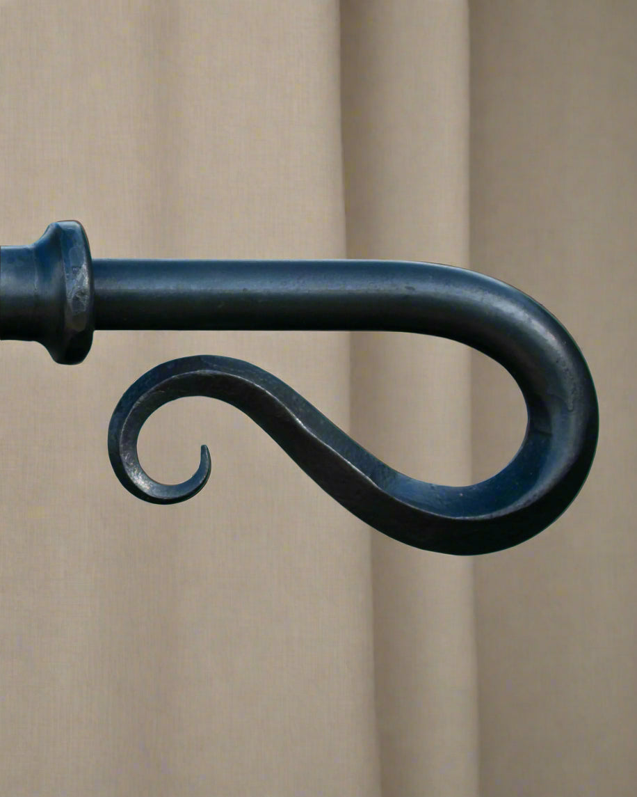 Square edged scroll finial