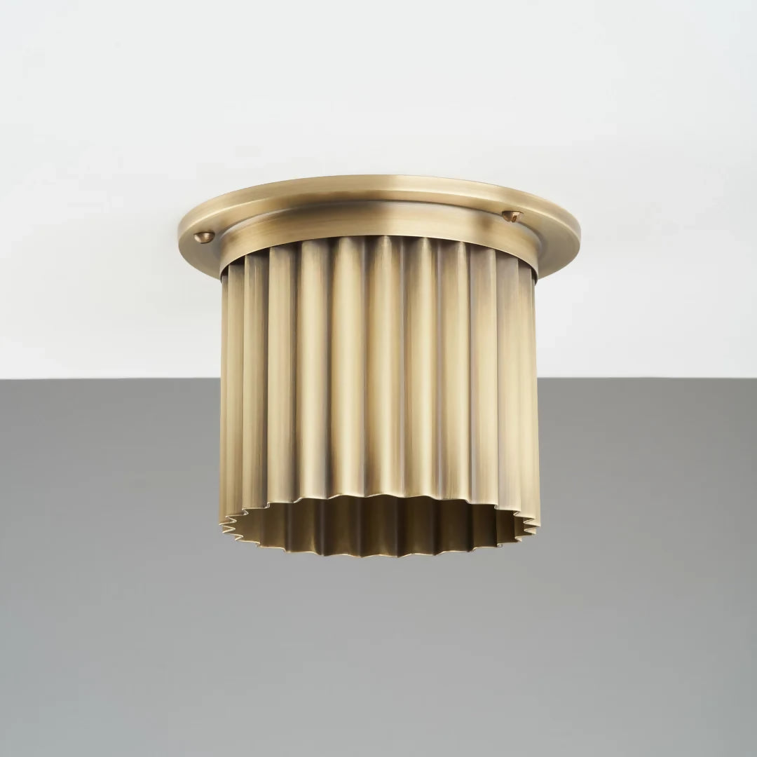 Decorative Bronze diffuser with a ribbed design on a gray background,  available  to buy on the-salon.com. SALON curates the finest , unique, handmade pieces from the interior industry's best makers and brands. Shop luxury furniture, lighting, rugs, art, antiques and vintage pieces and accessories from SALON interior designed rooms.