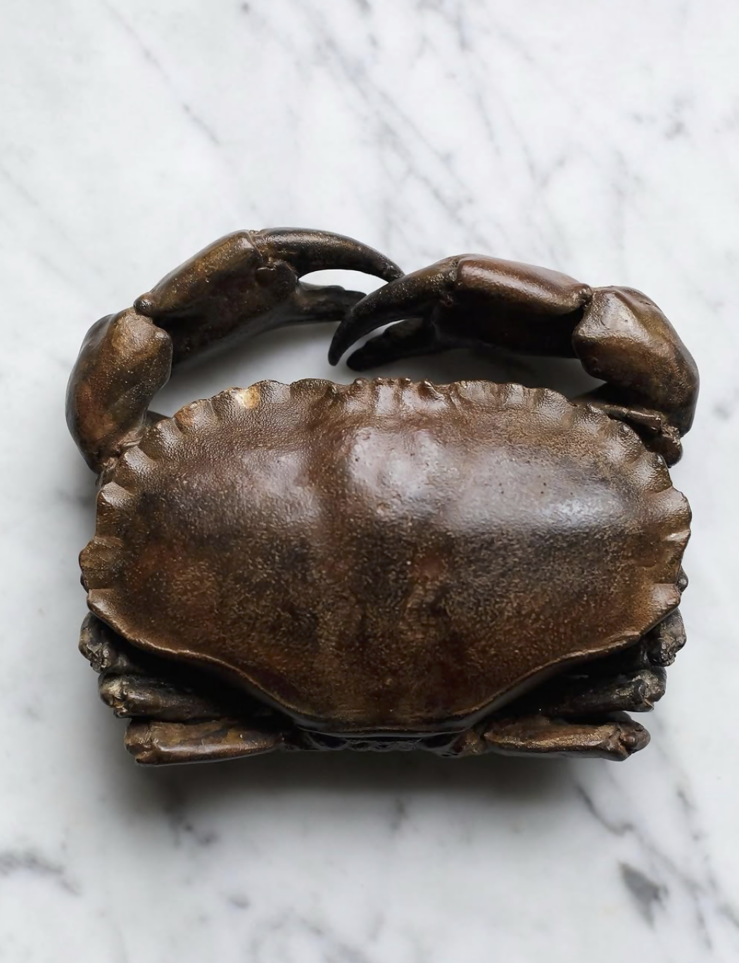 Bronze crab sculpture on a marble surface available  to buy on the-salon.com. SALON curates the finest , unique, handmade pieces from the interior industry's best makers and brands. Shop luxury furniture, lighting, rugs, art, antiques and vintage pieces and accessories from SALON interior designed rooms.