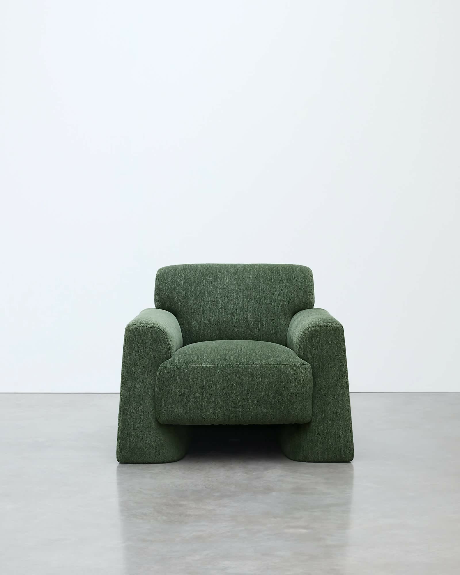 Green armchair on a white background, available  to buy on the-salon.com. SALON curates the finest , unique, handmade pieces from the interior industry's best makers and brands. Shop luxury furniture, lighting, rugs, art, antiques and vintage pieces and accessories from SALON interior designed rooms.