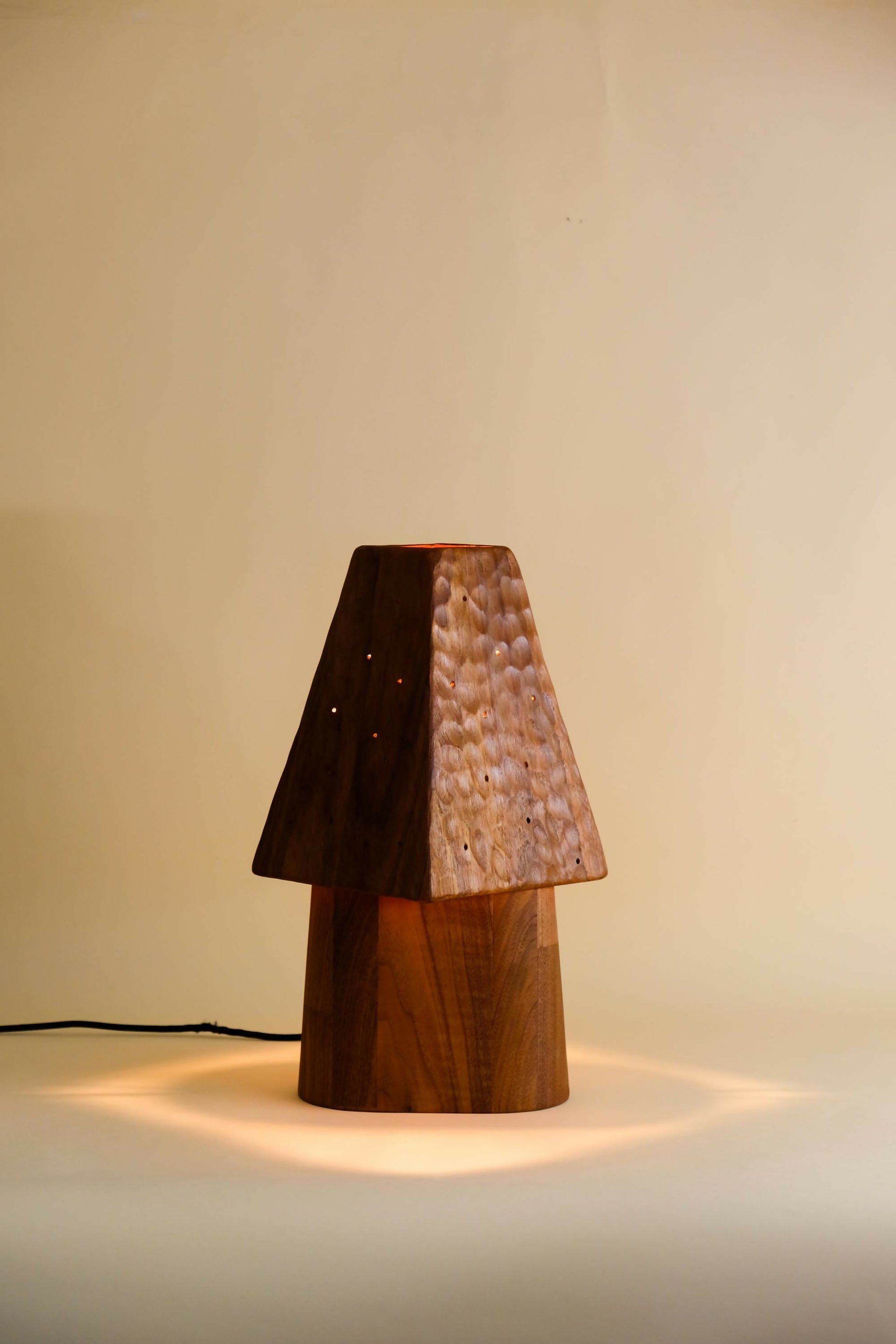 Wooden table lamp with a textured shade on a plain background, available  to buy on the-salon.com. SALON curates the finest , unique, handmade pieces from the interior industry's best makers and brands. Shop luxury furniture, lighting, rugs, art, antiques and vintage pieces and accessories from SALON interior designed rooms.