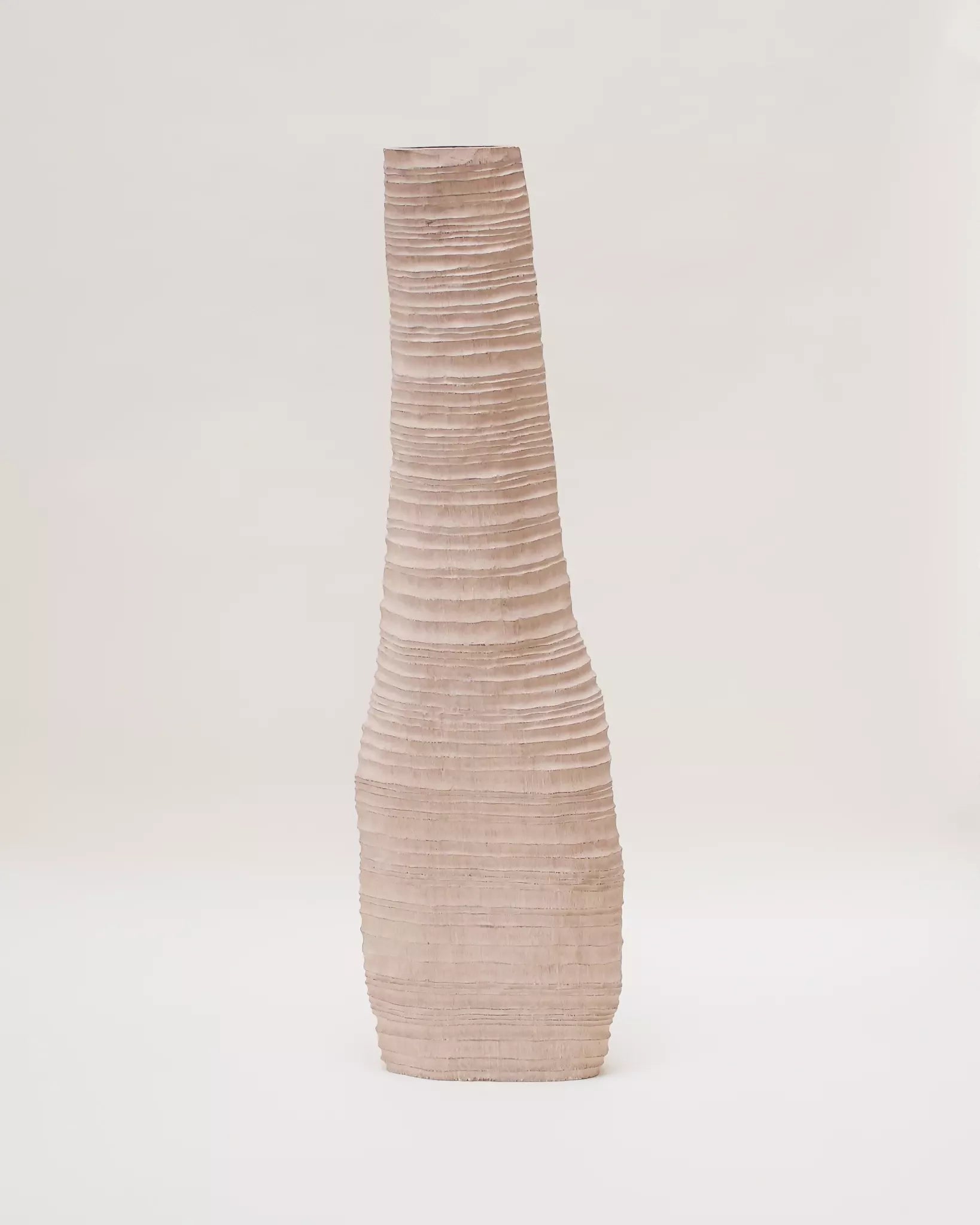 Textured vase on a light gray background,  available  to buy on the-salon.com. SALON curates the finest , unique, handmade pieces from the interior industry's best makers and brands. Shop luxury furniture, lighting, rugs, art, antiques and vintage pieces and accessories from SALON interior designed rooms.