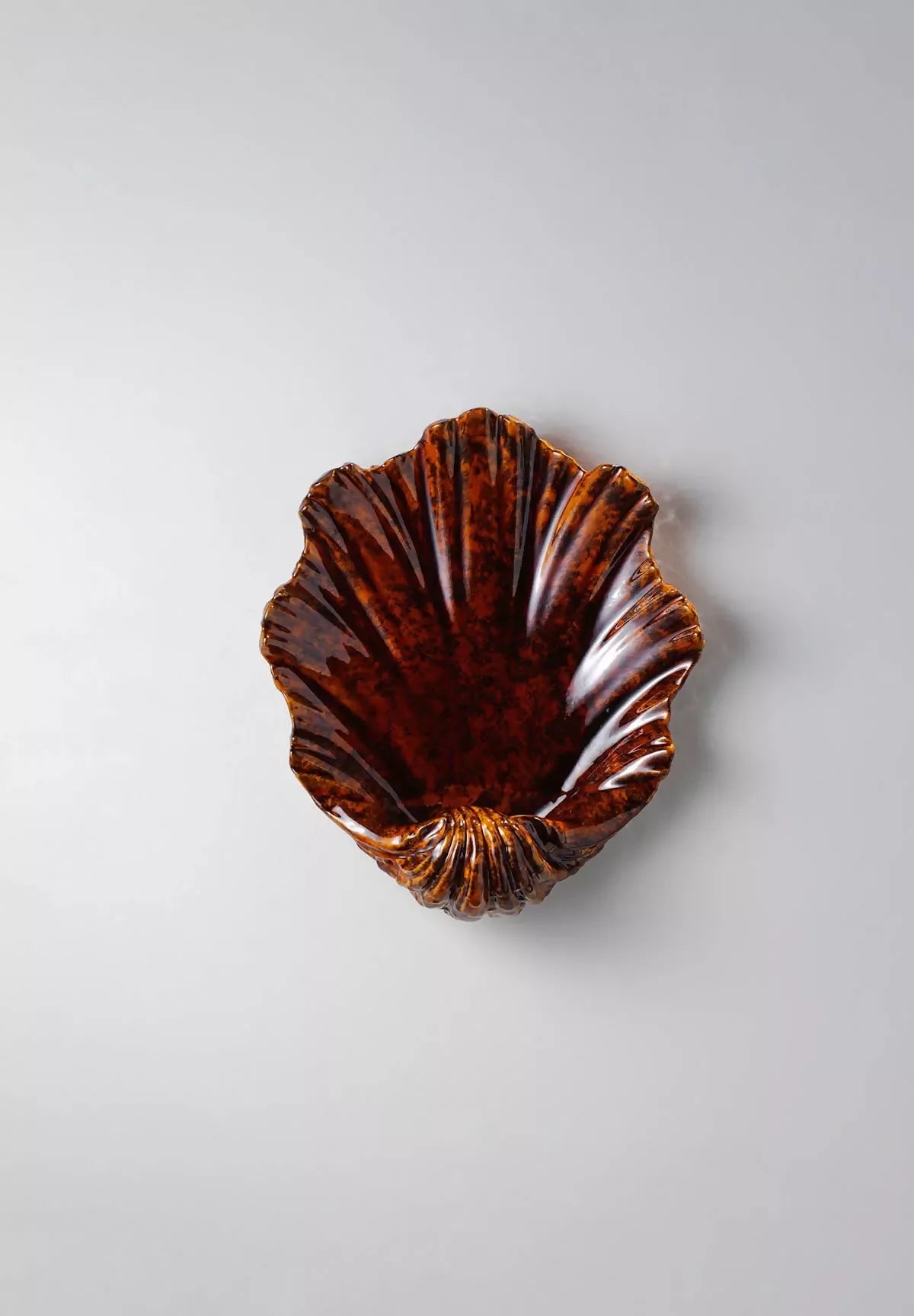 Scalloped tiger's eye Wall light, available  to buy on the-salon.com. SALON curates the finest , unique, handmade pieces from the interior industry's best makers and brands. Shop luxury furniture, lighting, rugs, art, antiques and vintage pieces and accessories from SALON interior designed rooms.