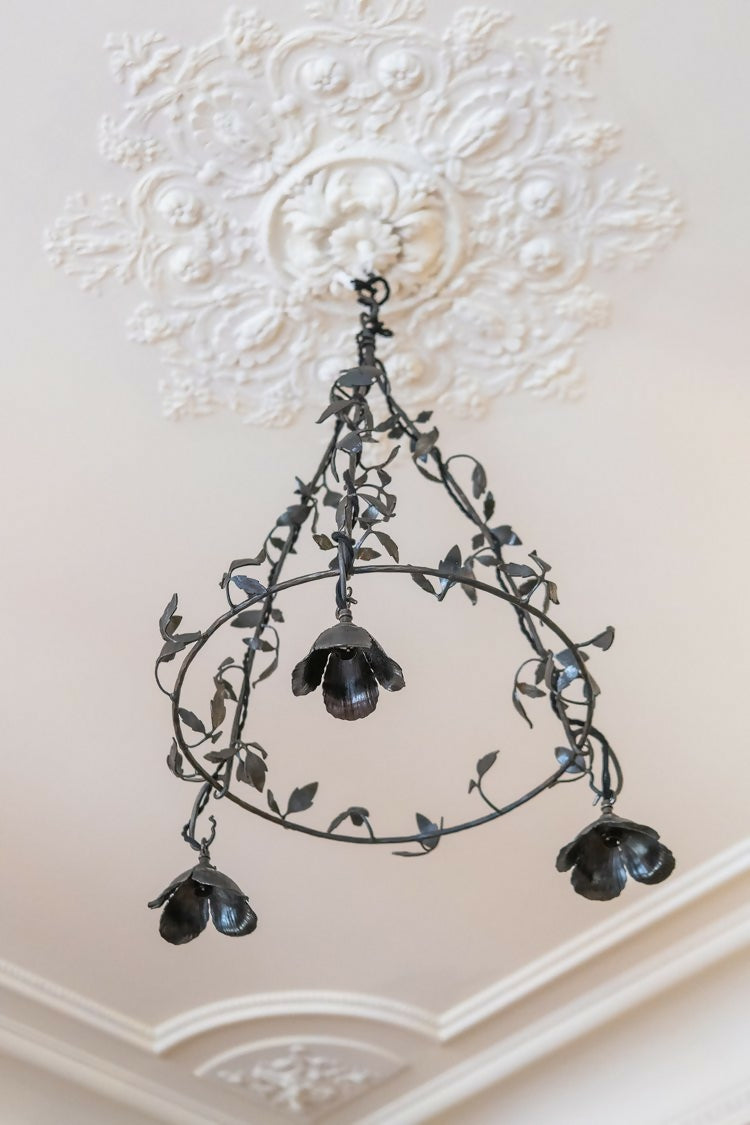 Decorative chandelier hanging from a ornate ceiling, available  to buy on the-salon.com. SALON curates the finest , unique, handmade pieces from the interior industry's best makers and brands. Shop luxury furniture, lighting, rugs, art, antiques and vintage pieces and accessories from SALON interior designed rooms.