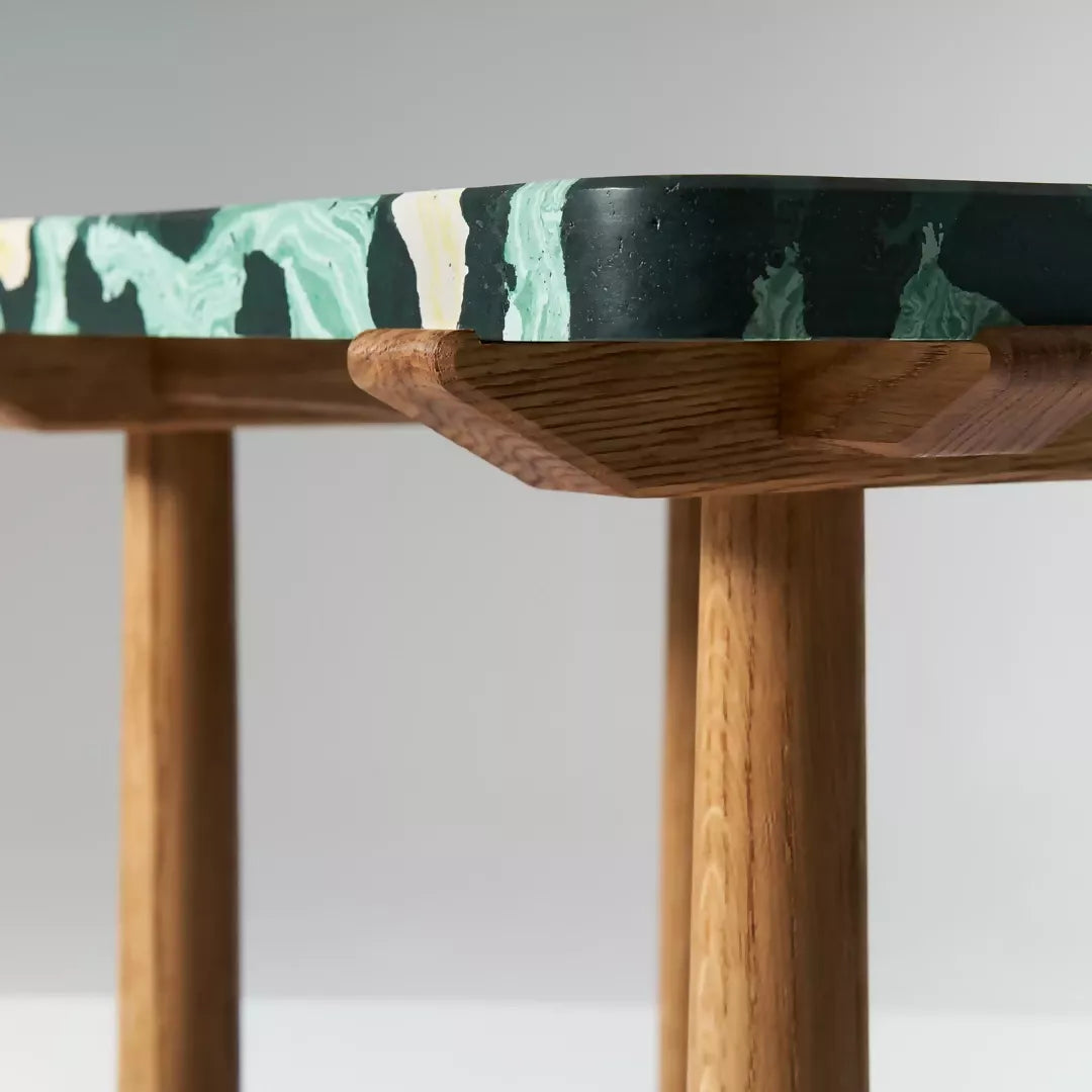 Wooden table with a patterned top on a plain background,  available  to buy on the-salon.com. SALON curates the finest , unique, handmade pieces from the interior industry's best makers and brands. Shop luxury furniture, lighting, rugs, art, antiques and vintage pieces and accessories from SALON interior designed rooms.