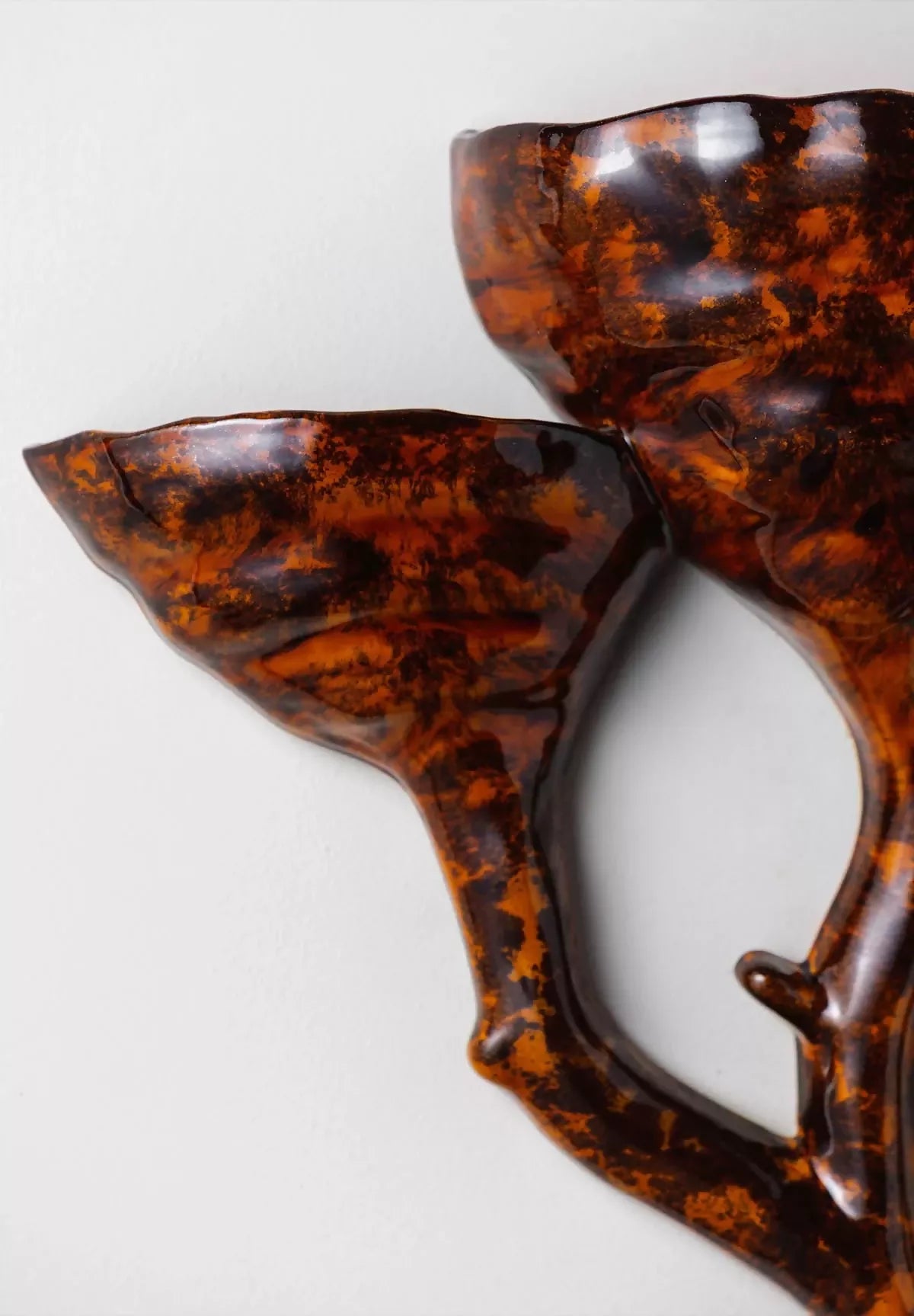 close-up on ceramic tiger's eye wall light- available  to buy on the-salon.com. SALON curates the finest , unique, handmade pieces from the interior industry's best makers and brands. Shop luxury furniture, lighting, rugs, art, antiques and vintage pieces and accessories from SALON interior designed rooms.