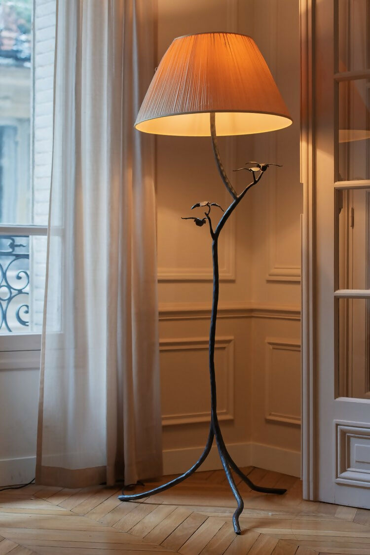 Decorative floor lamp with a large lampshade in a room with curtains and a door, available  to buy on the-salon.com. SALON curates the finest , unique, handmade pieces from the interior industry's best makers and brands. Shop luxury furniture, lighting, rugs, art, antiques and vintage pieces and accessories from SALON interior designed rooms.