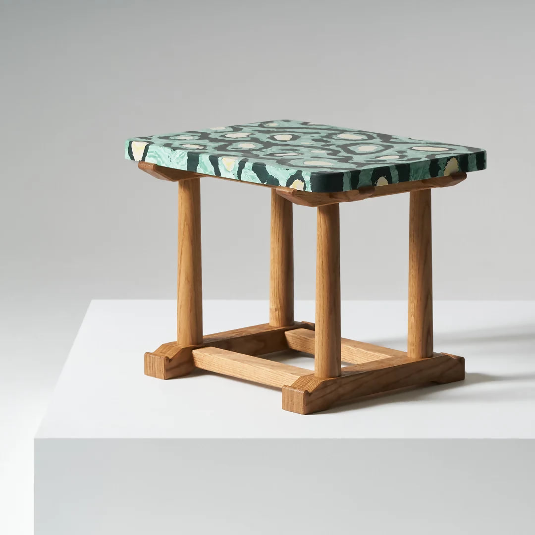 Small wooden table with a patterned green top on a white background,  available  to buy on the-salon.com. SALON curates the finest , unique, handmade pieces from the interior industry's best makers and brands. Shop luxury furniture, lighting, rugs, art, antiques and vintage pieces and accessories from SALON interior designed rooms.