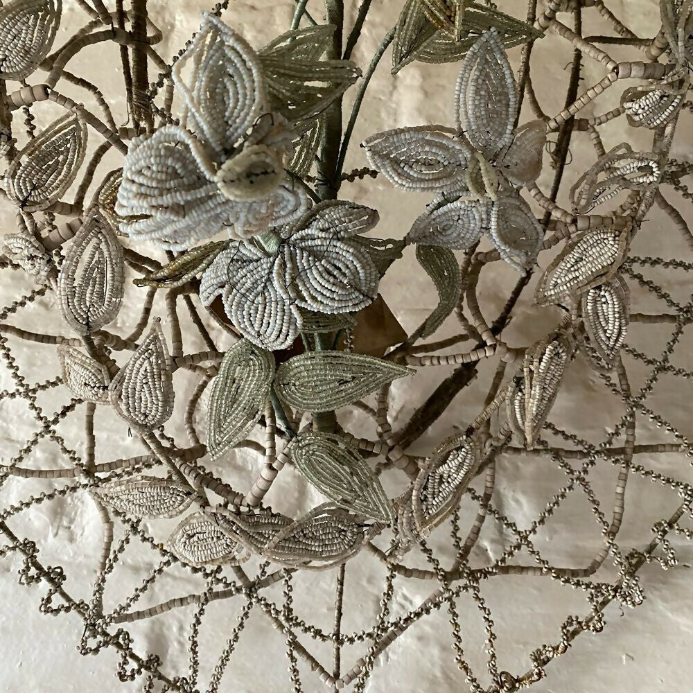 Close-up of intricate beaded leaf pattern on fabric,  available  to buy on the-salon.com. SALON curates the finest , unique, handmade pieces from the interior industry's best makers and brands. Shop luxury furniture, lighting, rugs, art, antiques and vintage pieces and accessories from SALON interior designed rooms.