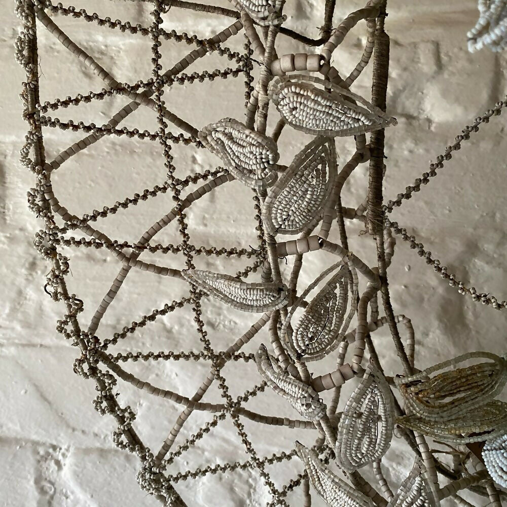 Decorative metalwork with leaf patterns on a textured wall,  available  to buy on the-salon.com. SALON curates the finest , unique, handmade pieces from the interior industry's best makers and brands. Shop luxury furniture, lighting, rugs, art, antiques and vintage pieces and accessories from SALON interior designed rooms.