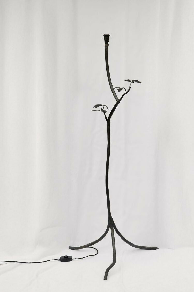 Black metal floor lamp with branch-like design on a white background, available  to buy on the-salon.com. SALON curates the finest , unique, handmade pieces from the interior industry's best makers and brands. Shop luxury furniture, lighting, rugs, art, antiques and vintage pieces and accessories from SALON interior designed rooms.