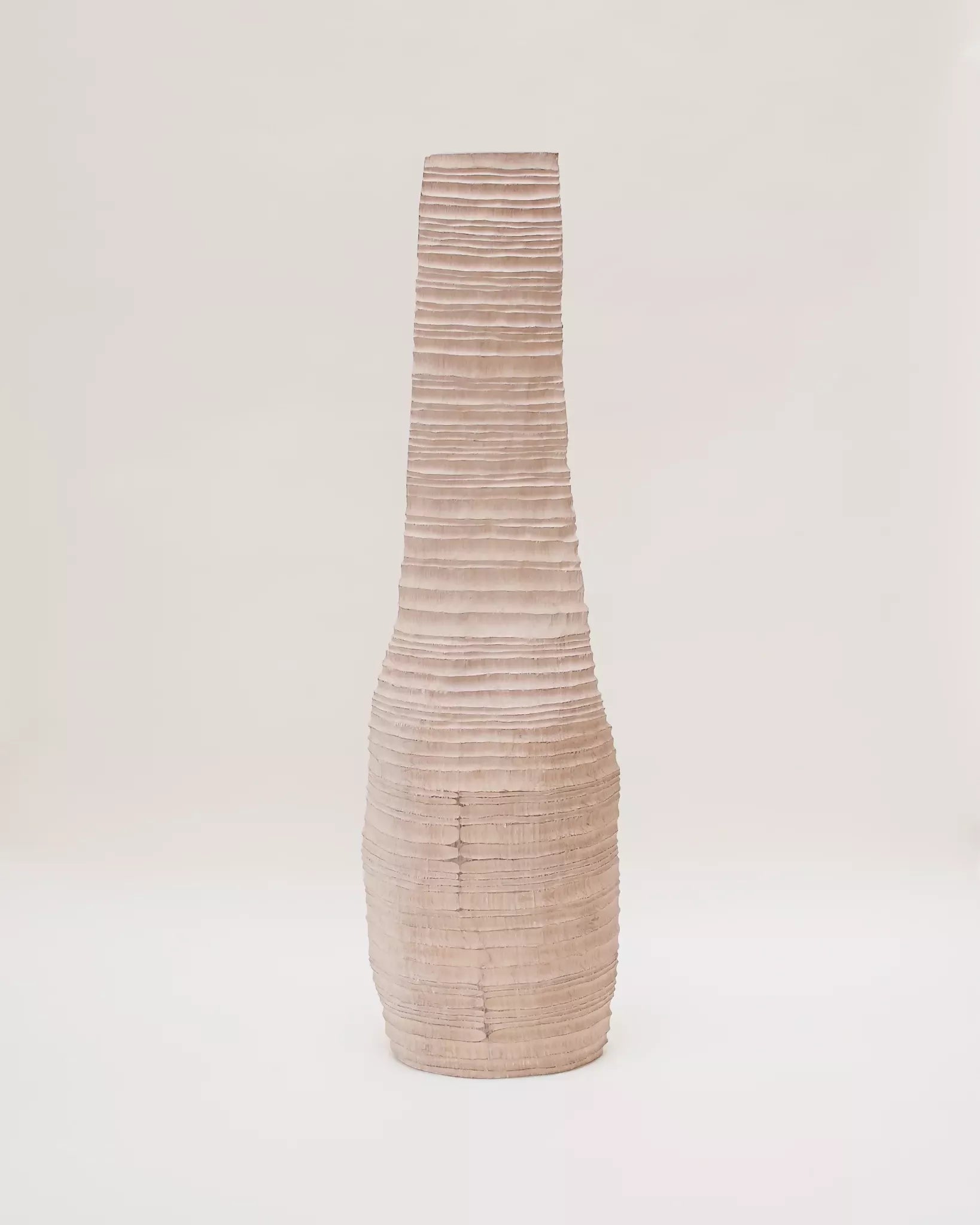 Textured vase on a light beige background,  available  to buy on the-salon.com. SALON curates the finest , unique, handmade pieces from the interior industry's best makers and brands. Shop luxury furniture, lighting, rugs, art, antiques and vintage pieces and accessories from SALON interior designed rooms.
